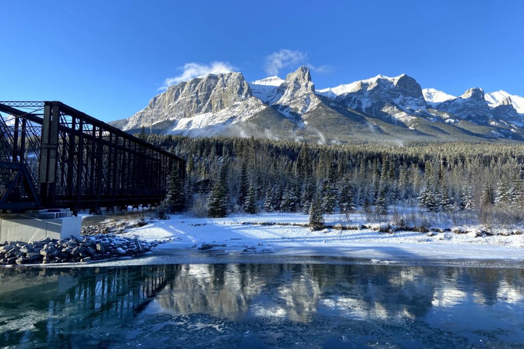 East end of rundle on a bright sunny day and the canmore engine bridge in winter