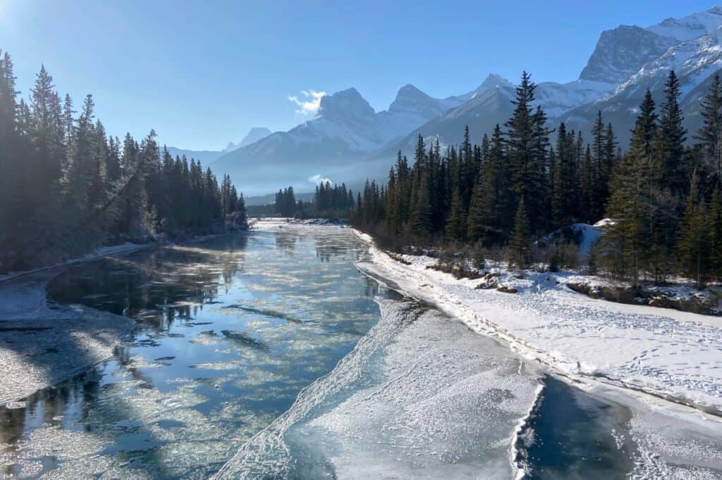 A winter view of the three sisters mountains from the engine bridge canmore alberta