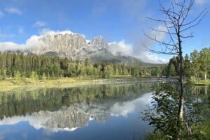 Stunning Quarry Lake Canmore Alberta On A Sunny Summer Morning With Mountains And Trees Reflected In The Water