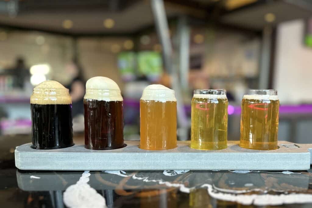 A flight of beers at blake brewhouse and distillery things to do in canmore at night
