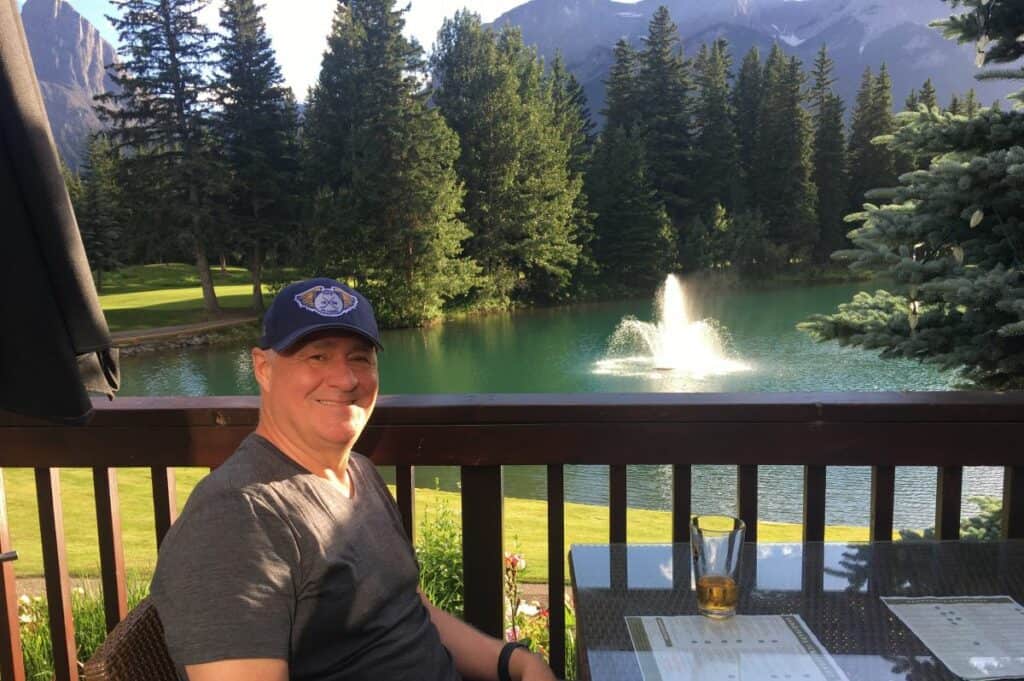 Kevin on the patio of canmore golf and curling club living in canmore alberta