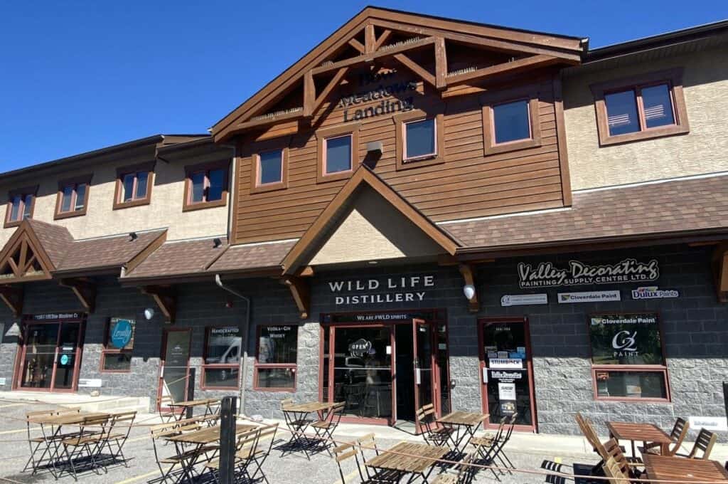 Wild life distillery patio on a sunny summer day one of the popular distilleries and breweries in canmore alberta