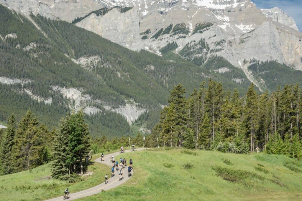 Cyclists on the legacy trail between canmore and banff one of the best free things to do in canmore
